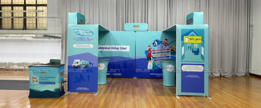 Custom tension fabric exhibition booth with portable fabric counters and U-shape backdrop by ZUST Printing Malaysia.